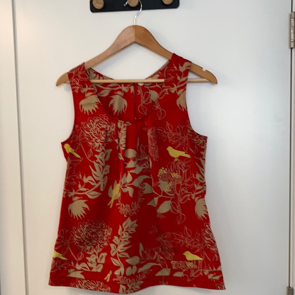 Gorgeous Red/orange Fossil Shell with tan and yellow floral design.